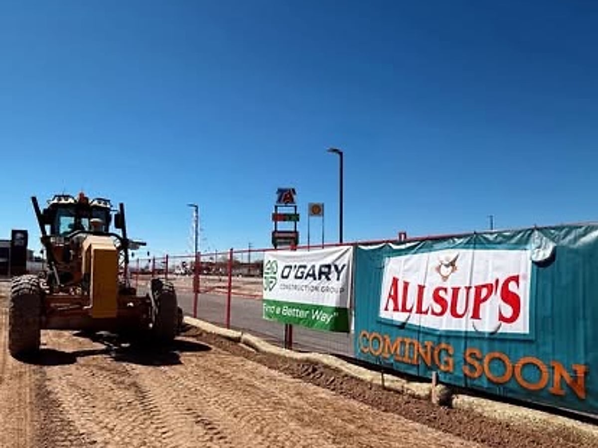 Motor grader working near the Allsup's site signage